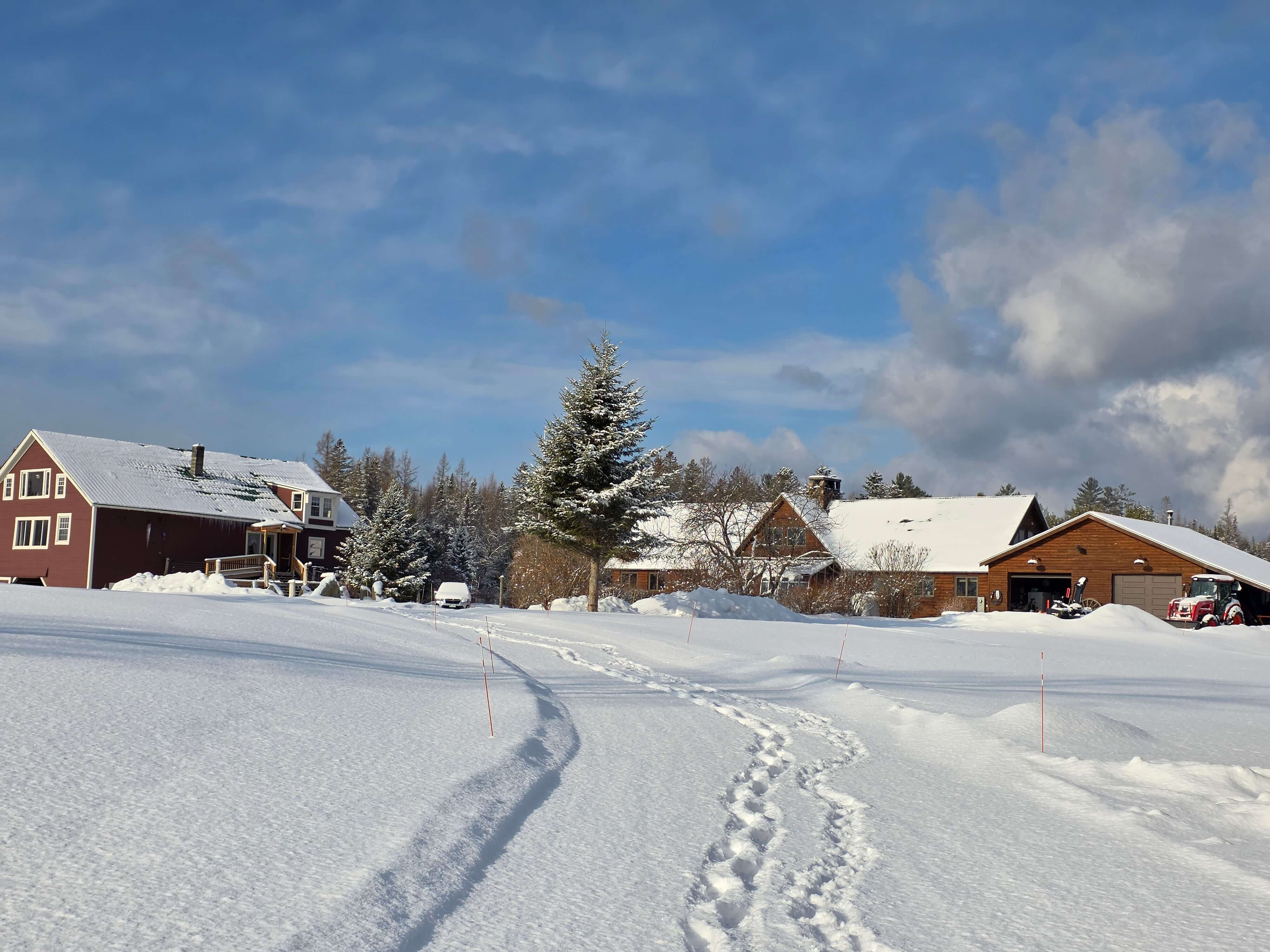 Roadside view of The Inn at Oxbow Acres in Milan, NH